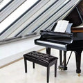 Banc de piano noir avec plateau boutonné et hauteur réglable